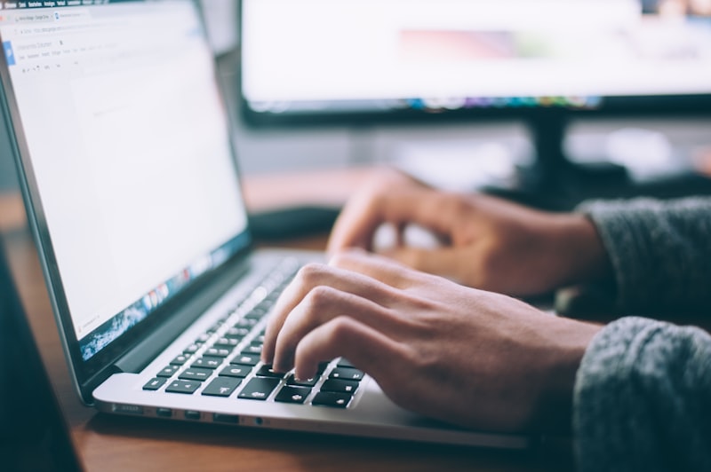 Person working on a laptop in a bright office
